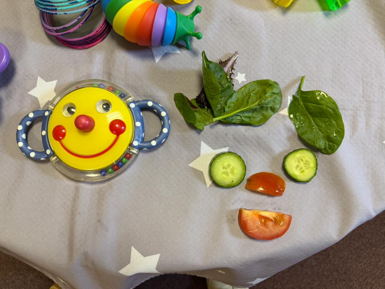 A playful arrangement of familiar foods and sensory toys