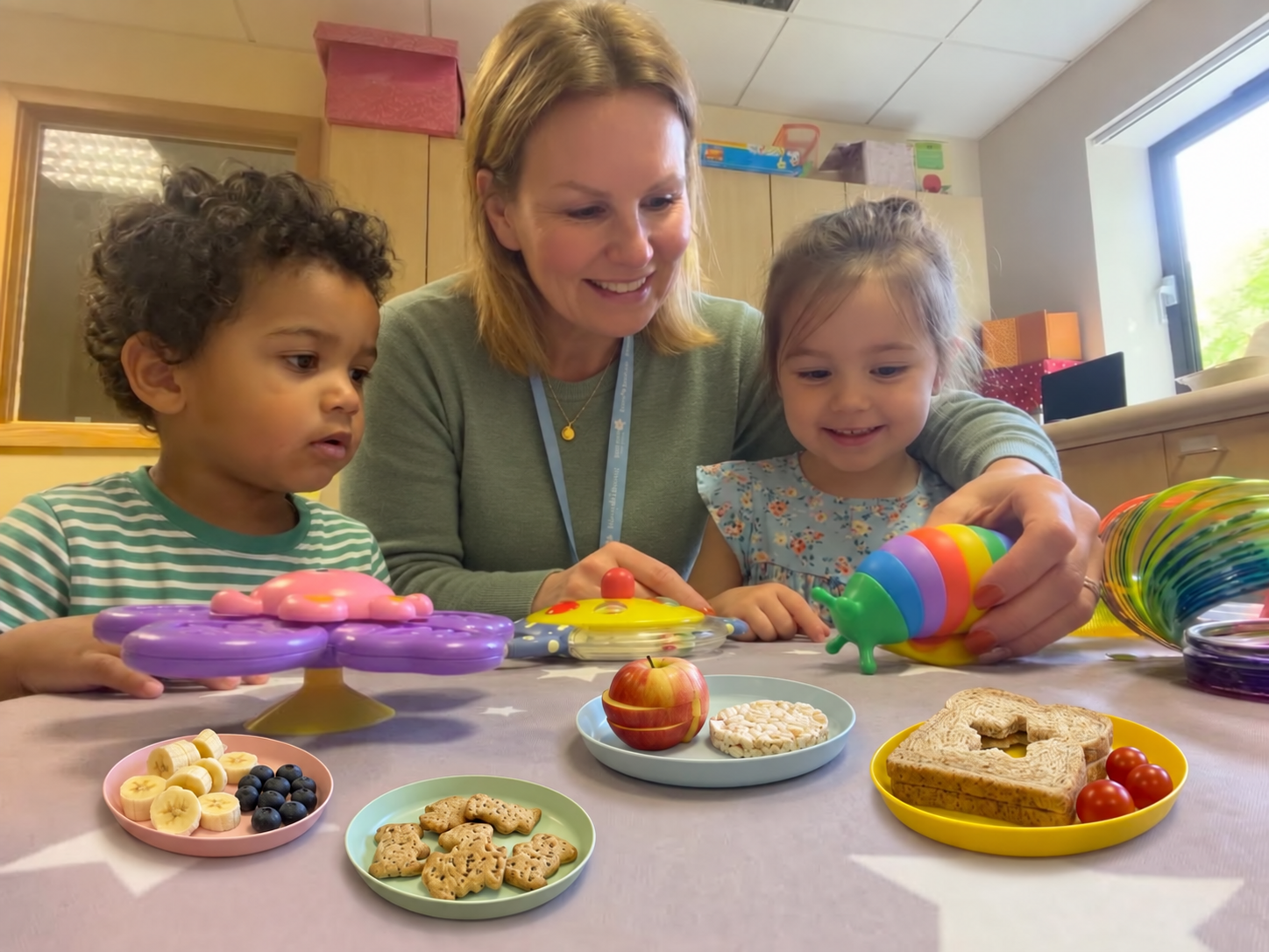 Iwona supporting two children during gentle food exploration